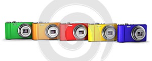 Five multicolor point and shoot photo cameras