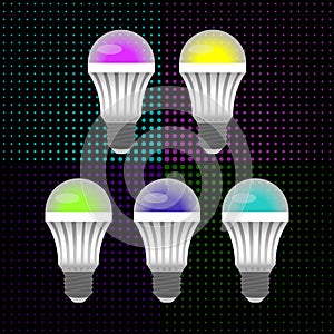 Five multicolored LED energy saving light bulbs in the background of small circles