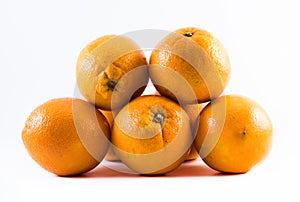 Five nicely colored oranges on a white background - front and back next to each other