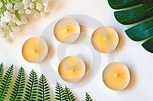 Five non-burning candles on white background top view