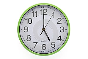 Five o`clock. Wall clock showing time on white background. Clipping path included