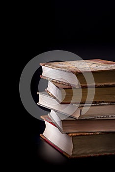 Five old books in atmospheric light