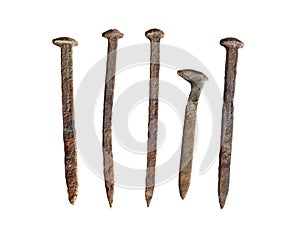 Five old rusted spikes isolated