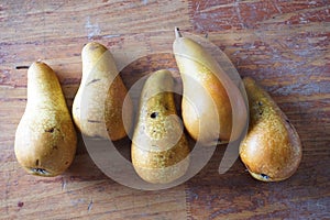 Five pears on a table