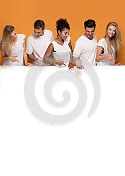 Five people posing with white empty board.