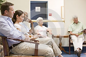 Five people waiting in waiting room photo