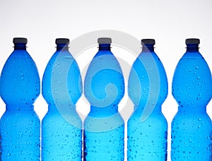 Five plastic bottles