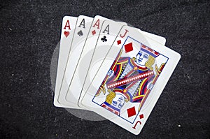 Five playing card`s a hand of a four of a kind ace`s and a jack