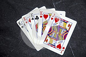 Five playing card`s a hand of a four of a kind king`s and a jack
