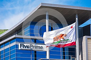 Five Prime Therapeutics logo at the biopharmaceutical company headquarters in Silicon Valley. Flag of California proudly waving -