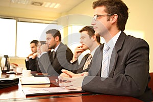 Five professionals at a Conference