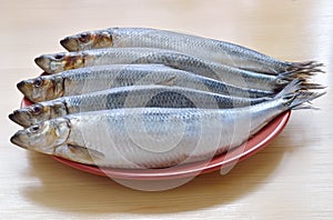 Five raw herring horizontally