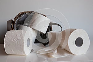 Five Rolls of Toilet Paper Spilling Out of Basket