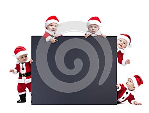 Five Santa Claus baby hold black advertisment banner blank