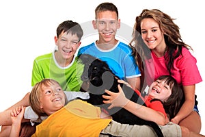 Five siblings with black dog