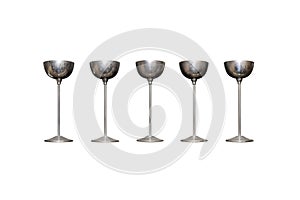 Five silver, old goblets on a long leg, isolated on a white background with a clipping path.