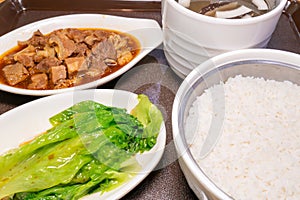 five-spice beef brisket rice and coconut chicken soup with mushrooms at horizontal composition