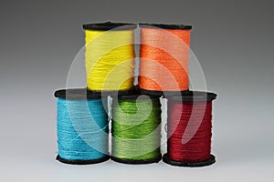 Five stacked Spools of Yarn