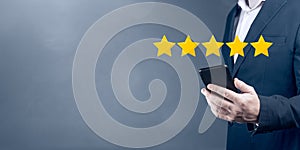 Five stars 5 rating with businessman touching screen, concept about positive customer feedback and review, excellent performance.