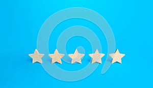 Five stars on a blue background. Rating evaluation concept. High satisfaction. Good reputation. Popularity rating of restaurants