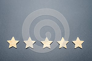 Five stars on a gray background. Rating and status of the restaurant or hotel. Prestige and a good title. High quality photo