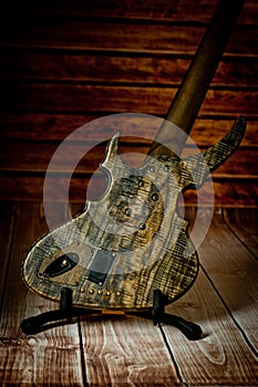 Five-string electric dark wood bass. Background for music and creativity