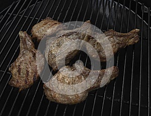 Five tasty roasted pork chops on a gas grill