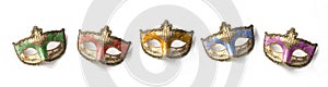 Five theater or mardi gras venetian masks on white background