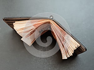 Five-thousandth banknotes in the wallet.