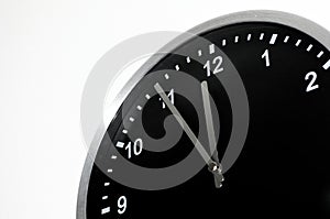 Five To Midnight setting on the black wall clock