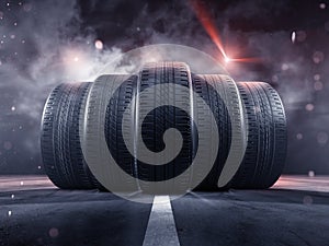 Five tyres rolling on a street photo