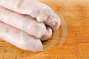 Five uncooked sausages