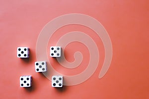 Five white dice on an orange background. Combination: Poker on the five