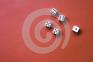 Five white dice on an orange background. Combination: two pairs of sixes and fives photo