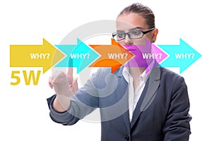 Five whys concept with businessman pressing virtual button