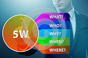 Five whys concept with businessman pressing virtual button photo