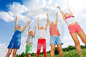 Five wonderful children jumping in the air