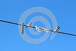 Pegs on a clothesline.