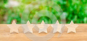 Five wooden stars. Get the fifth star. The concept of the rating of hotels and restaurants, the evaluation of critics and visitors