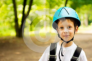 Five year boy on rope-way in forest