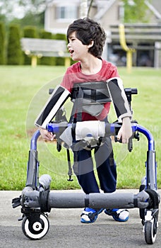 Five year old disabled boy in walker