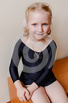 Five-year-old girl in a sports suit