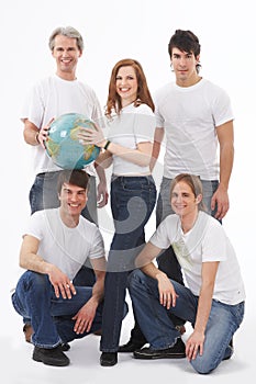 Five young people with a globe