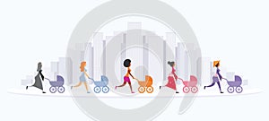 Five young women are walking with their prams