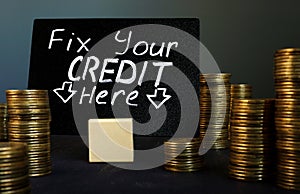 Fix your credit here handwritten sign and money