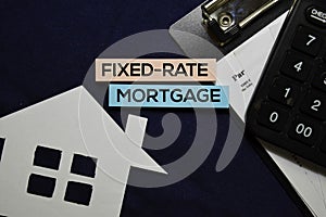 Fixed-rate Mortgage text on sticky notes isolated on office desk.