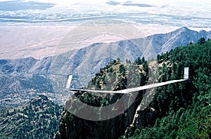 A Fixed-Wing Glider Launches From Sandia Crest, NM photo