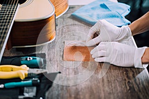 Fixing acoustic guitar, Close-up