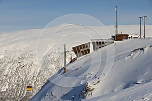 Fjellheisen aerial tramway arrives to the upper station at the top of the Fjellheisen mountain, Tromso, Norway.