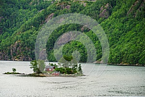 Fjord landscape with hytte on isle, Norway photo